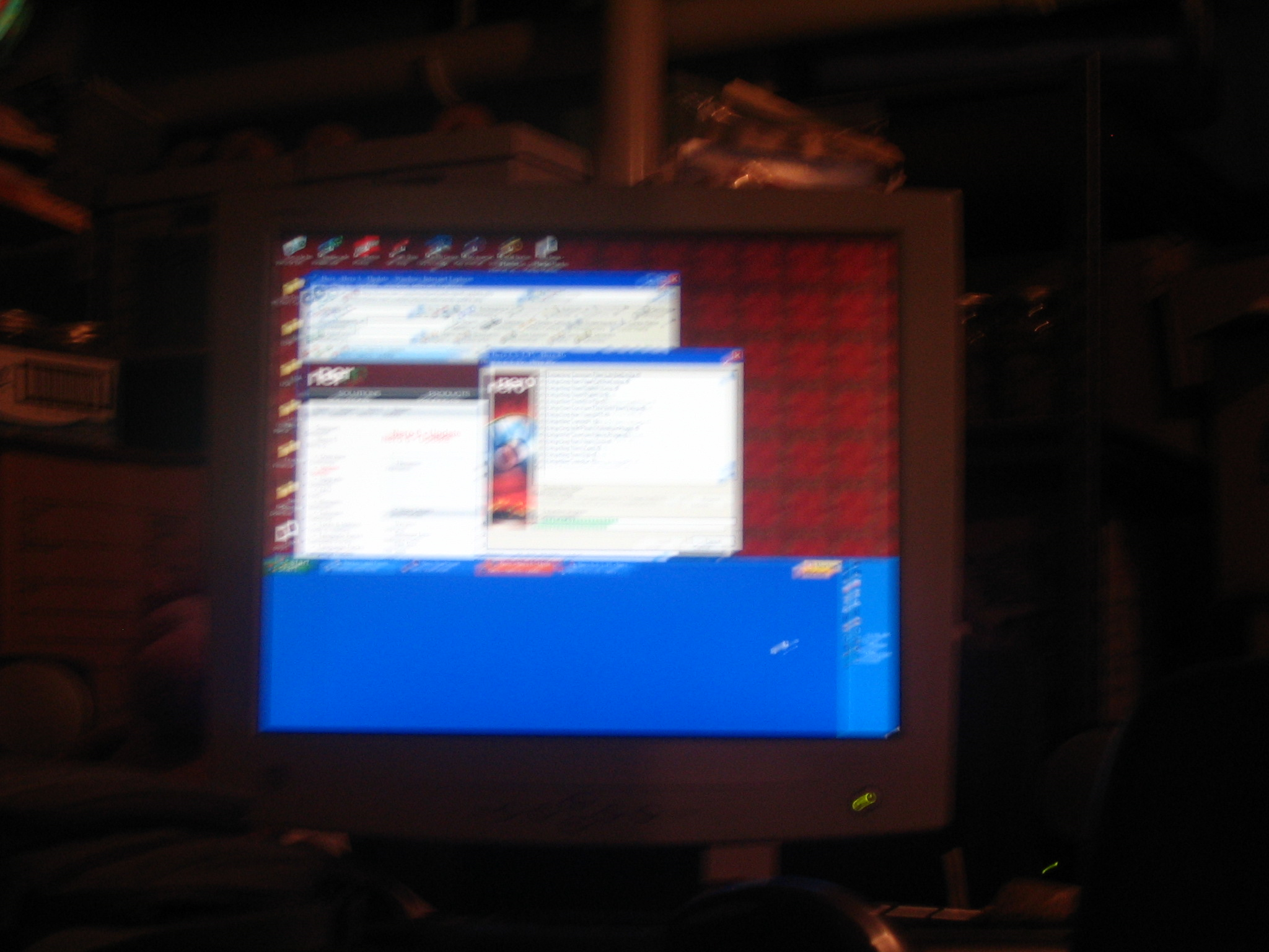 Blurry photo of a CRT monitor running Windows XP with a massive toolbar